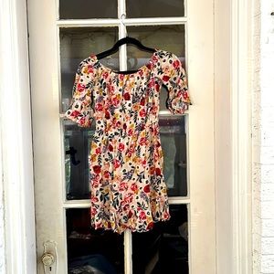 I am selling a HYPE romper that has a dark yellow tone with flower designs